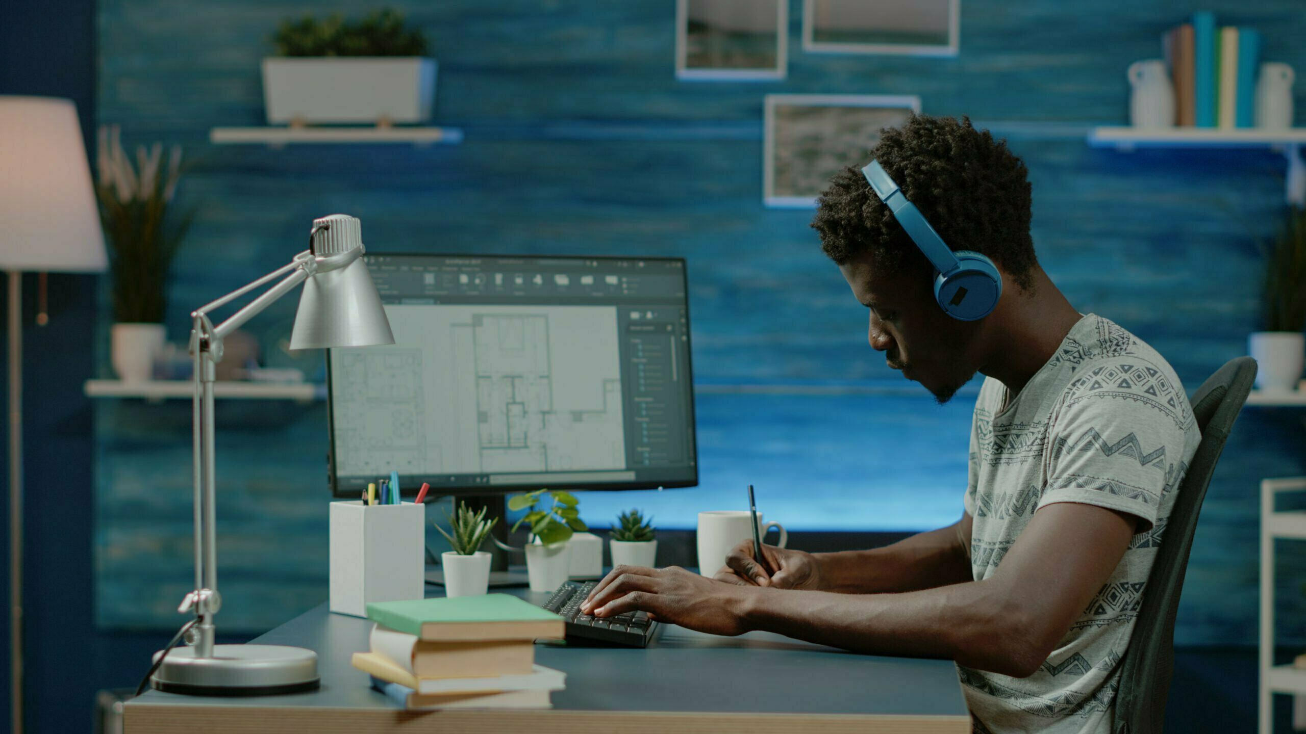 African american engineer designing blueprint plan