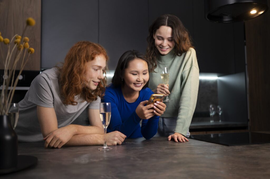 medium-shot-friends-reading-cell-phone-messages